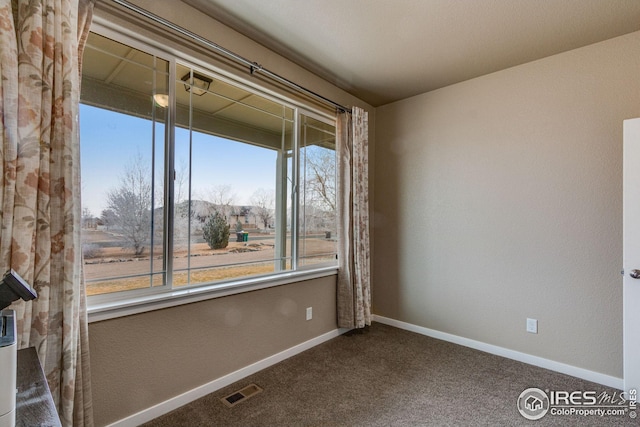 view of carpeted spare room