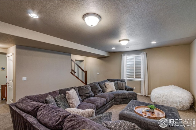 living room featuring a textured ceiling and light colored carpet