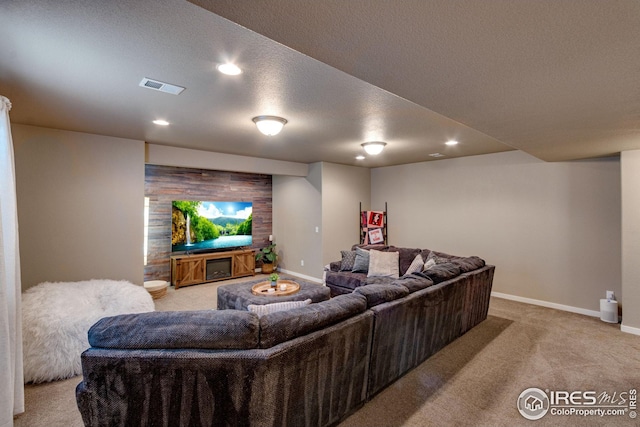 living room with light carpet and a textured ceiling