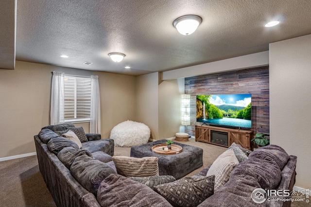 carpeted living room featuring a textured ceiling