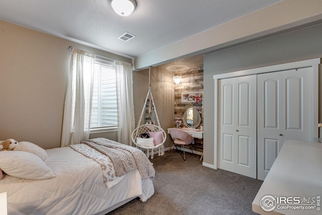 bedroom with carpet floors and a closet