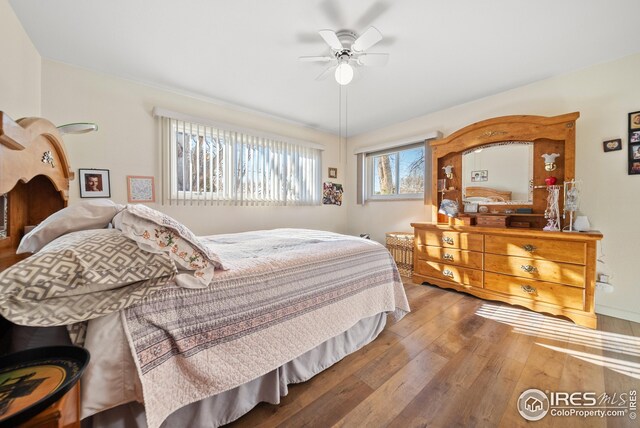 bedroom featuring wood-type flooring and ceiling fan