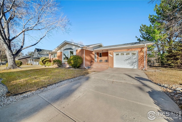 single story home featuring a front lawn and a garage