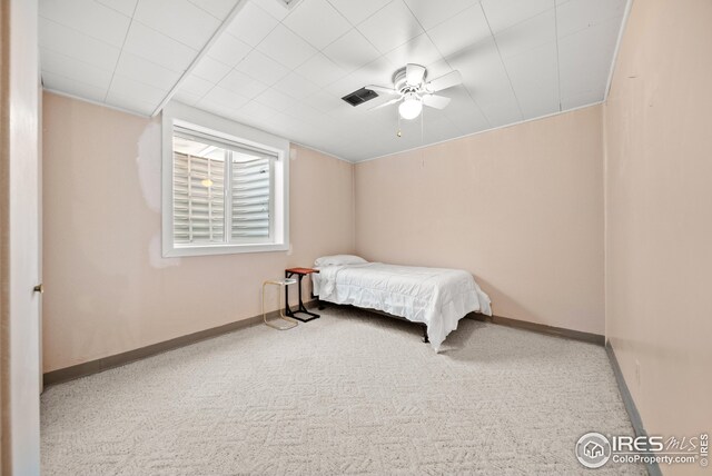 carpeted bedroom with ceiling fan