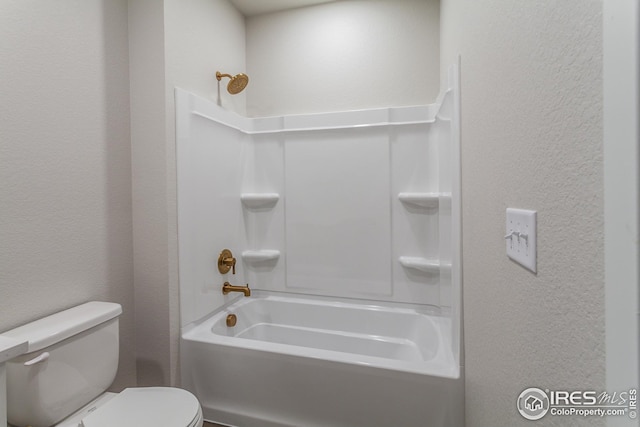 bathroom with toilet and  shower combination