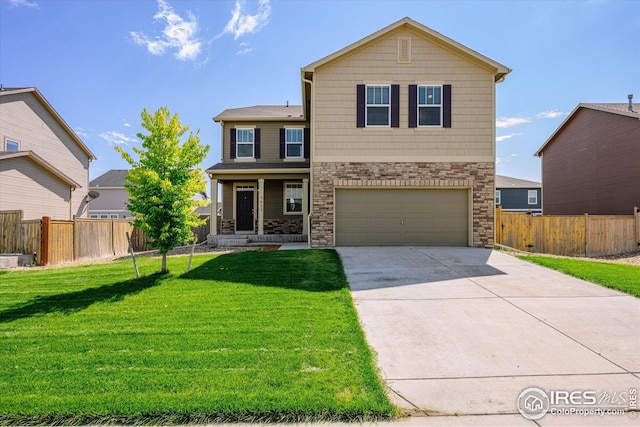 front of property with a garage and a front lawn