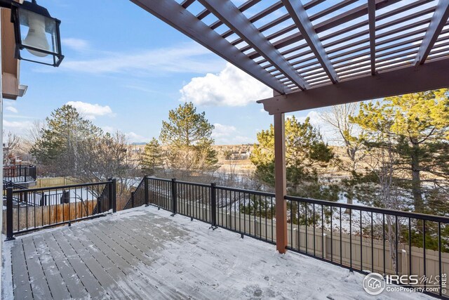 wooden deck featuring a pergola