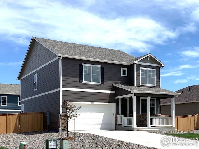 view of front facade featuring a porch and a garage