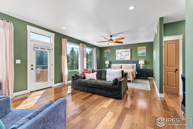 bedroom with access to exterior, recessed lighting, a ceiling fan, wood finished floors, and baseboards