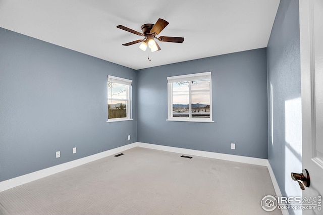 empty room featuring ceiling fan