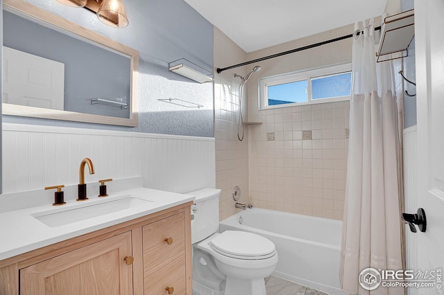 full bathroom featuring shower / bath combo with shower curtain, vanity, and toilet