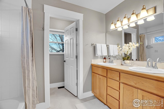 bathroom featuring vanity and shower / tub combo