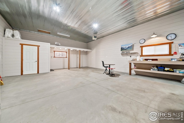 garage featuring wooden walls