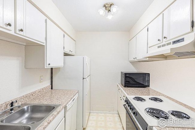 kitchen with sink, white cabinets, and white appliances