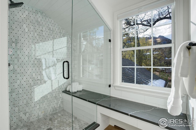 bathroom featuring an enclosed shower