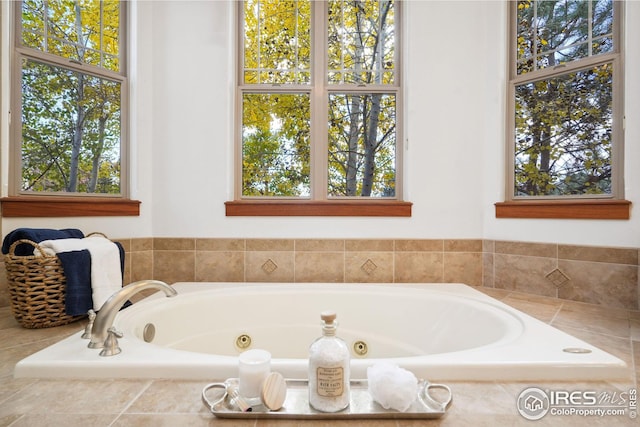 bathroom featuring a relaxing tiled tub