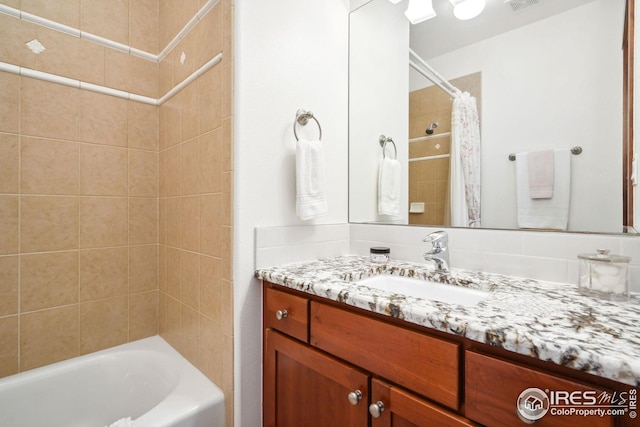 bathroom with vanity and shower / bath combination with curtain