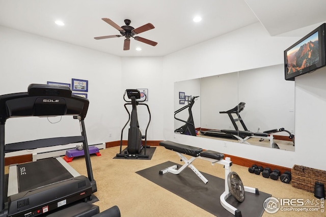 workout room featuring ceiling fan and carpet floors