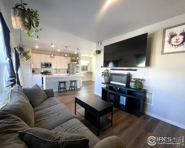 living room featuring dark hardwood / wood-style floors