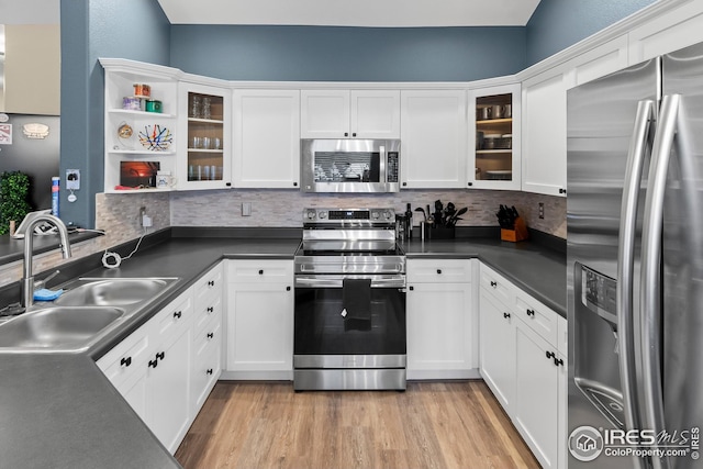 kitchen featuring sink, white cabinets, and appliances with stainless steel finishes