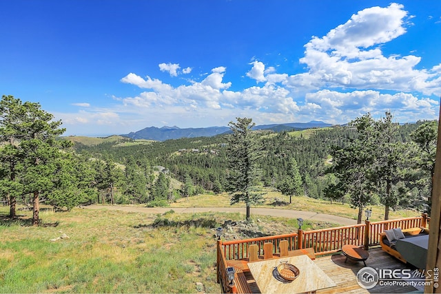 property view of mountains featuring a forest view