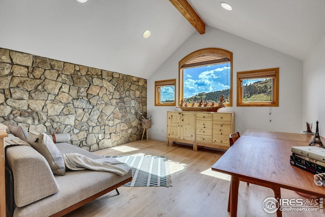 interior space with recessed lighting, lofted ceiling with beams, and wood finished floors