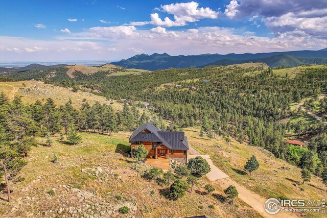 aerial view with a forest view and a mountain view
