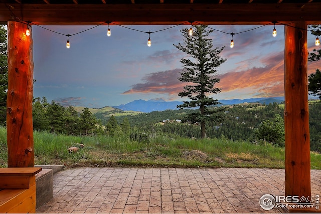 view of patio / terrace with a mountain view