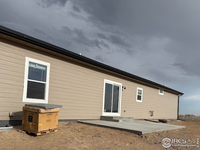 rear view of property featuring a patio area