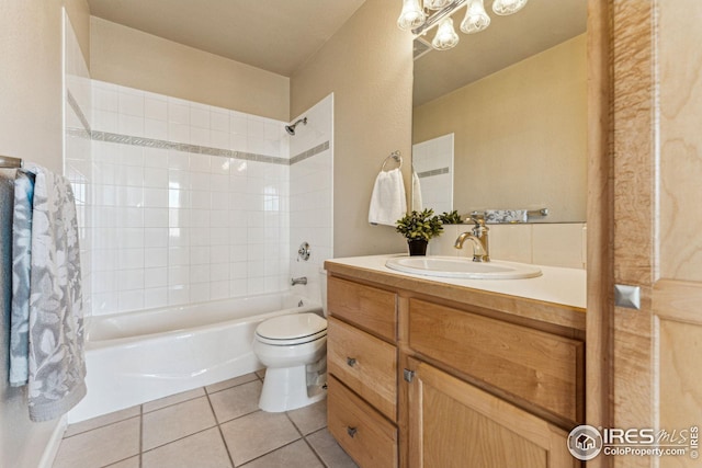 full bathroom with toilet, tile patterned flooring, washtub / shower combination, and vanity