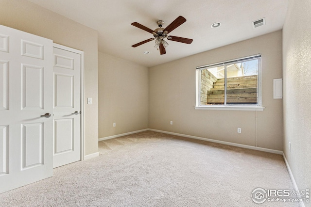 unfurnished bedroom featuring ceiling fan, recessed lighting, carpet floors, visible vents, and baseboards