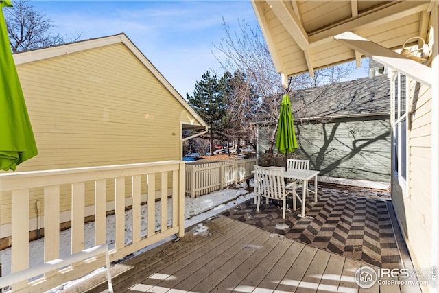 deck with outdoor dining area