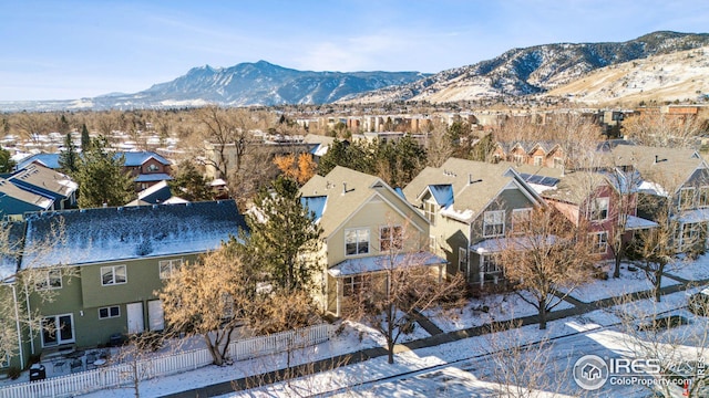 drone / aerial view featuring a residential view and a mountain view