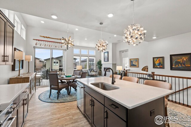 kitchen with stainless steel gas stove, decorative backsplash, wall chimney range hood, and dark brown cabinetry