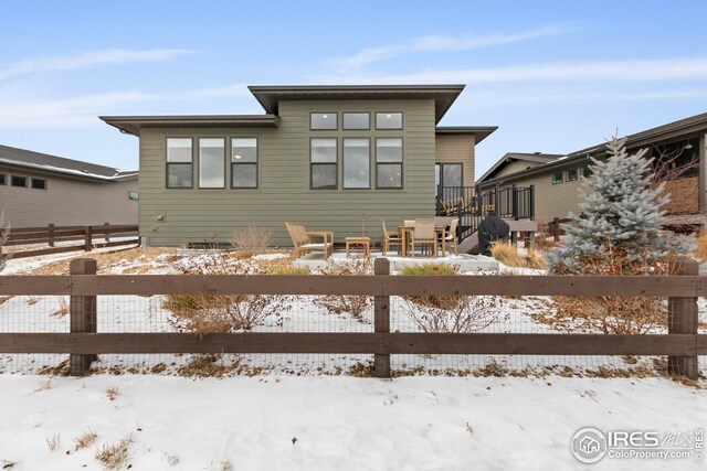 view of snow covered deck