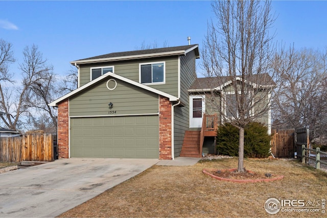 view of front of home featuring a front yard and a garage