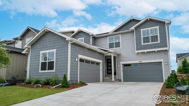 craftsman inspired home featuring concrete driveway and an attached garage