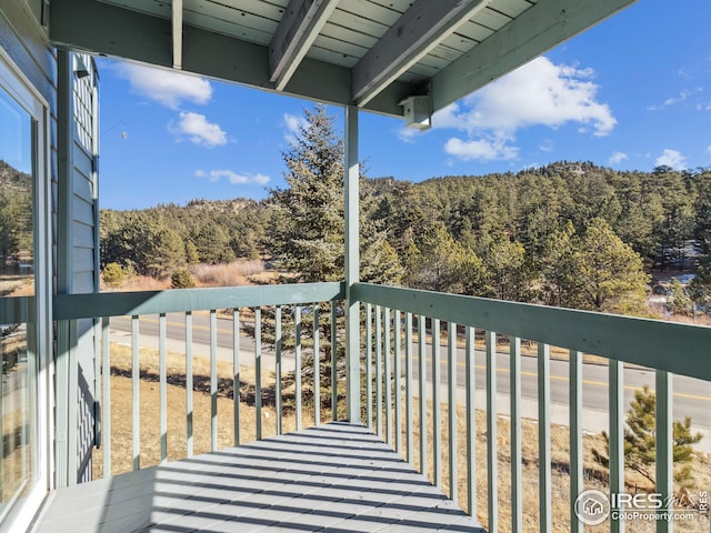 balcony with a forest view