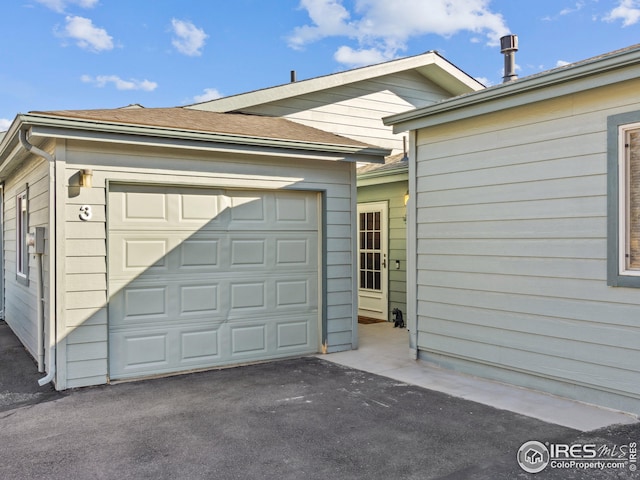 garage featuring driveway