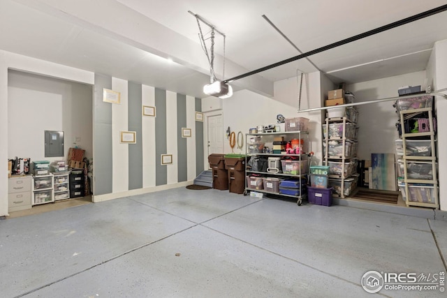 garage featuring a garage door opener and electric panel