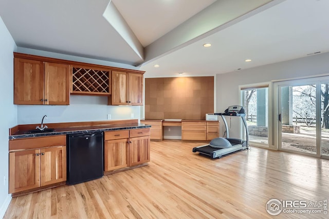 kitchen with sink, light hardwood / wood-style floors, and dishwasher