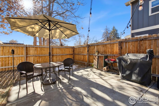 view of patio with a grill