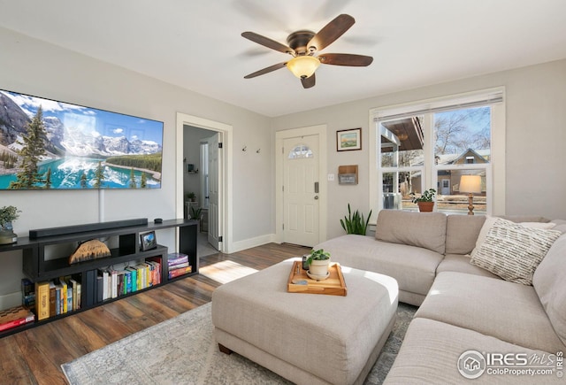 living room featuring ceiling fan and wood-type flooring