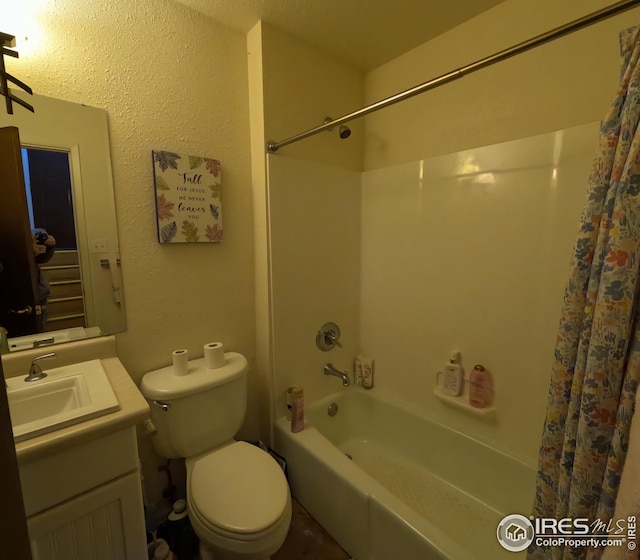 full bathroom featuring washtub / shower combination, toilet, and vanity