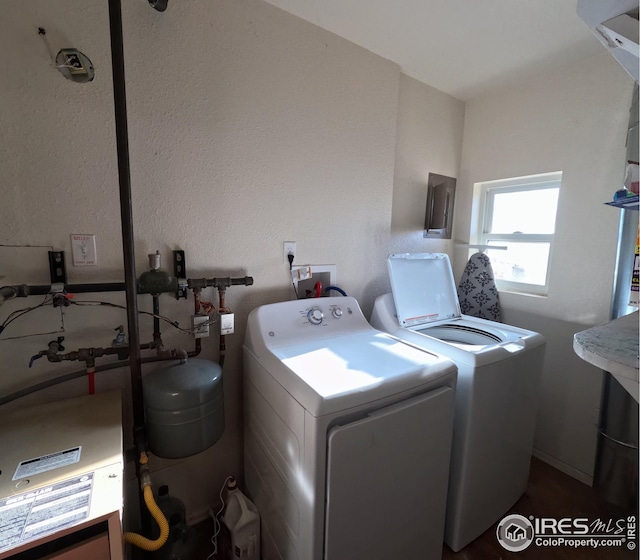 laundry area with independent washer and dryer