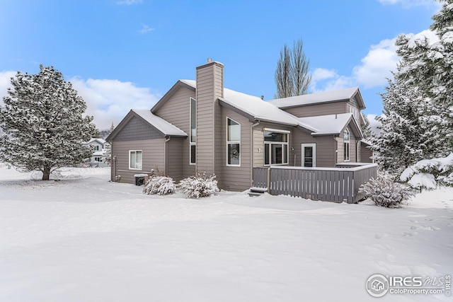 view of snow covered house