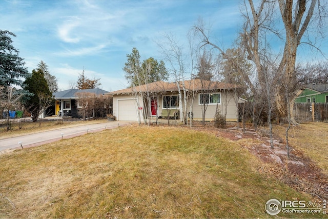 single story home with a garage and a front lawn