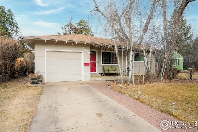 ranch-style home featuring a garage