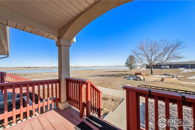 deck featuring a water view