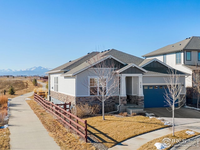 view of front of house featuring a mountain view and a garage